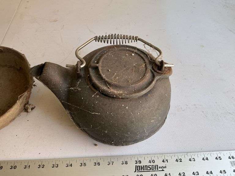 Cast-iron teapot and pans