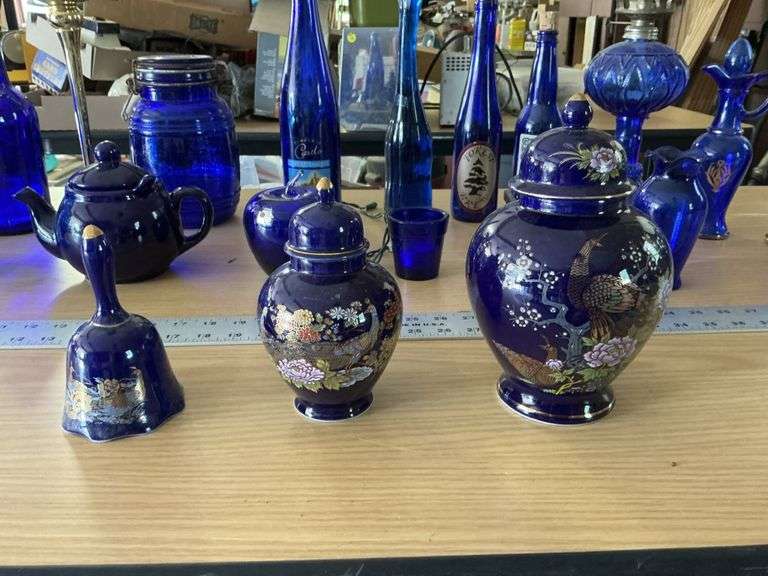 Blue bottles/glassware/oil lamp