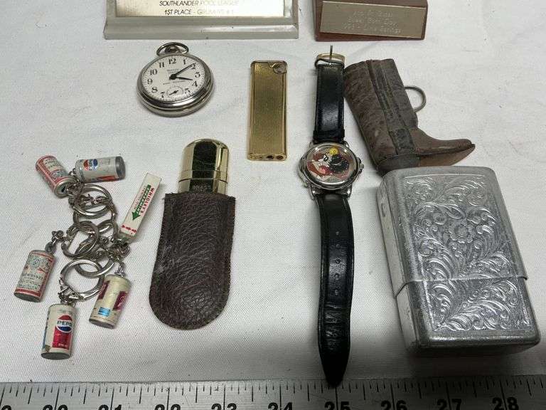 Trophies, pocket watch, lighters, Taz watch, etc.