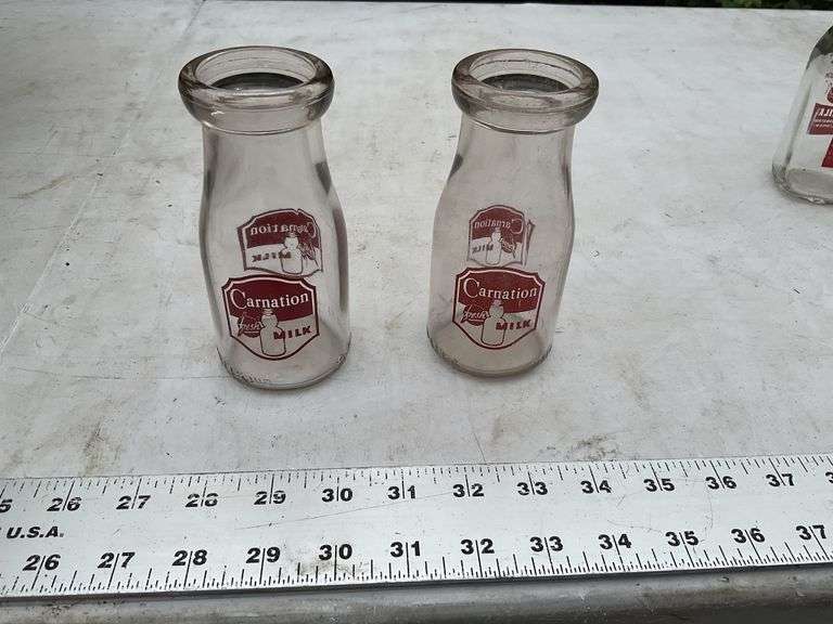 2- Carnation half pint milk bottles