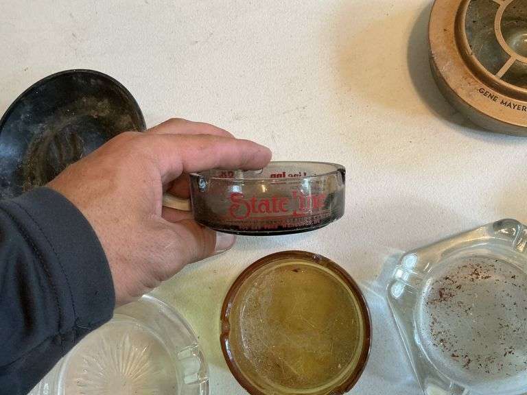 Ashtrays, some advertising.