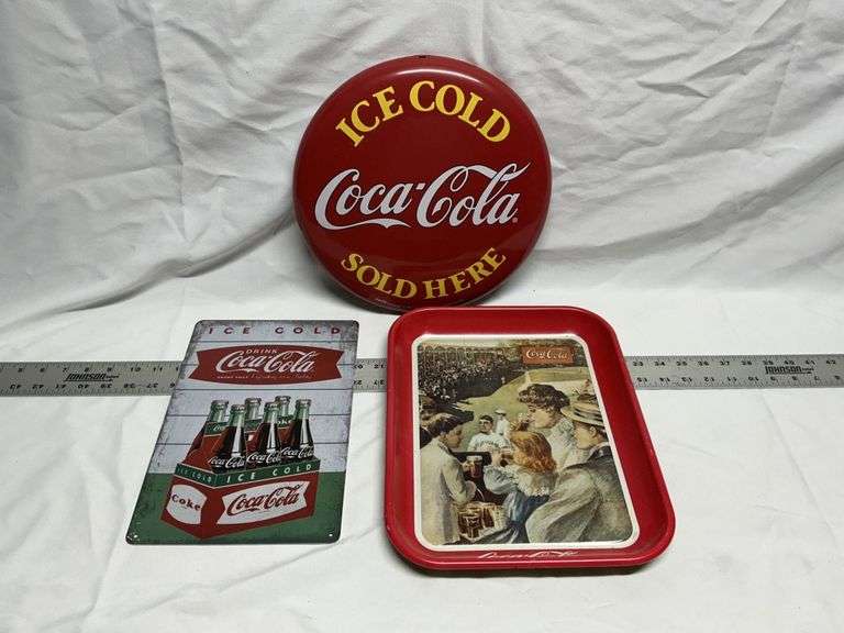 Coca-Cola tins, sign