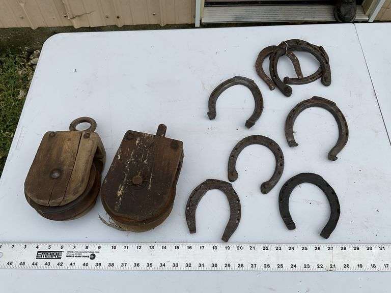 2- wooden pulleys and vintage horseshoes