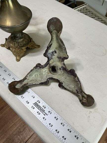 Cast-iron base and heavy decorative pitchers