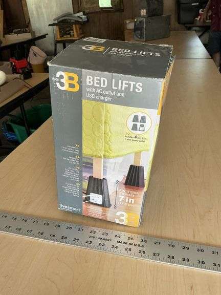 Bed lifts with outlets
