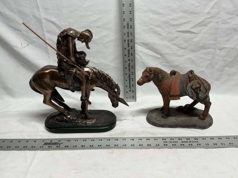 Horse statues, both are missing an ear