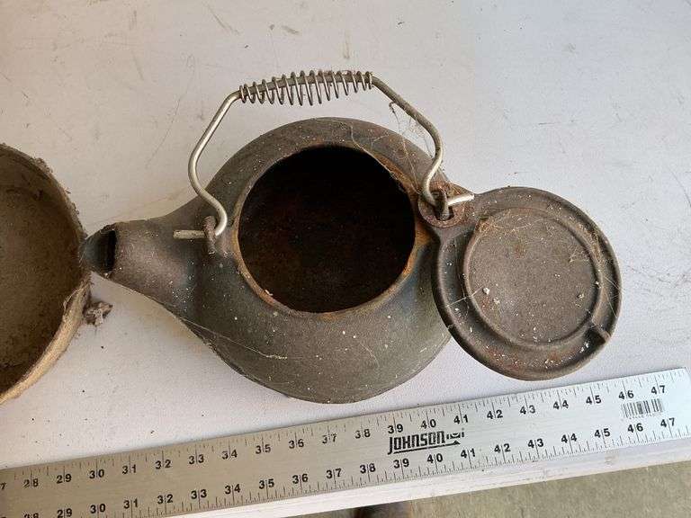 Cast-iron teapot and pans