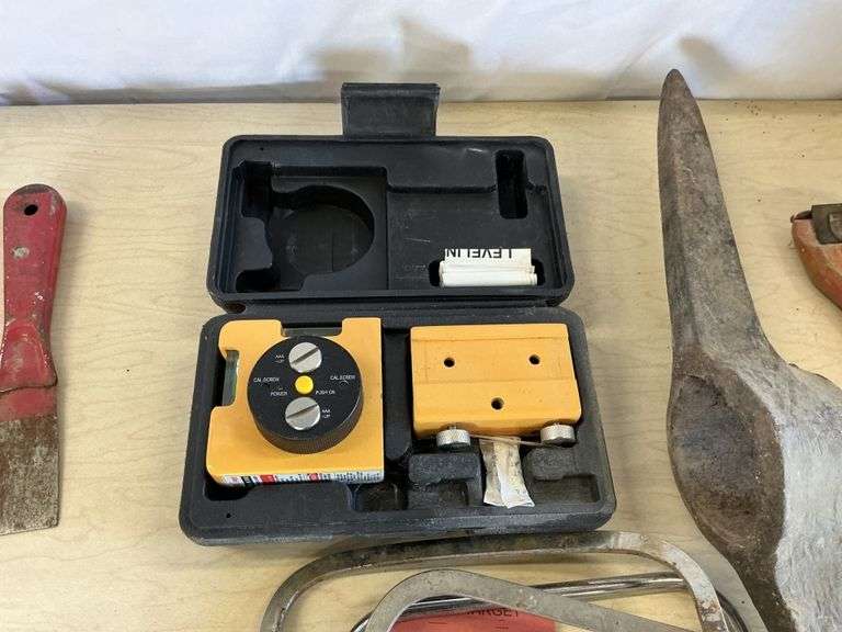 Assorted tools and laser level