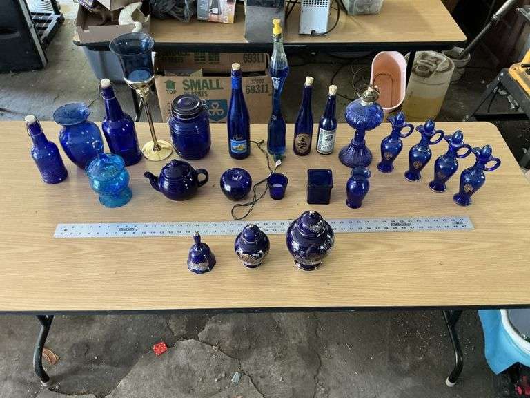 Blue bottles/glassware/oil lamp