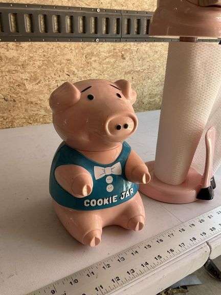 Plastic pig cookie jar and towel holder