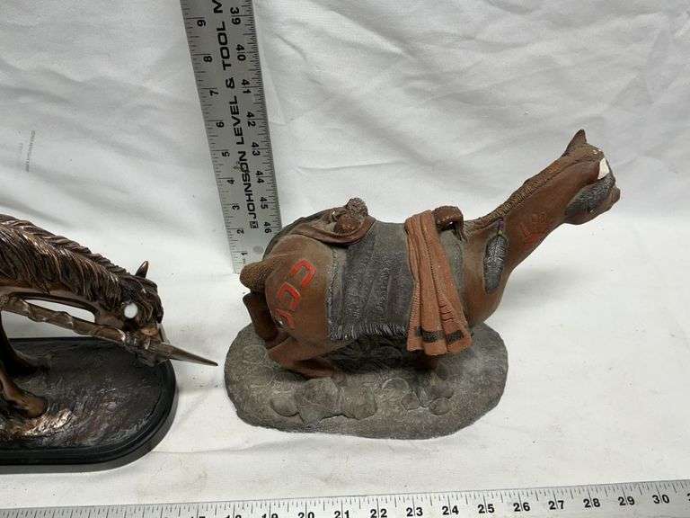 Horse statues, both are missing an ear