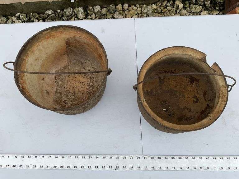 2- cast, footed kettles
