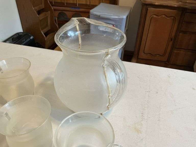 Plastic Kool-Aid pitcher and mugs