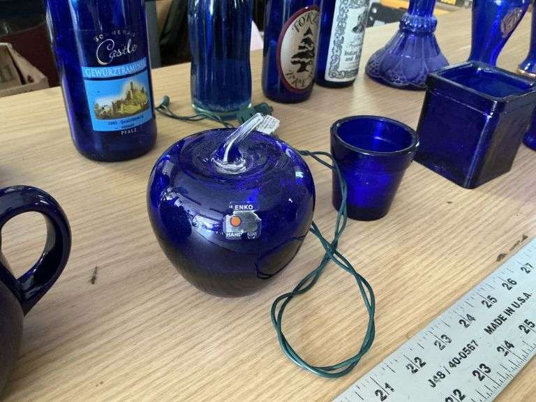 Blue bottles/glassware/oil lamp