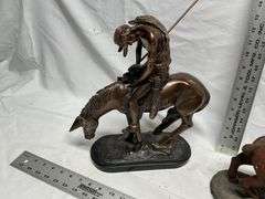 Horse statues, both are missing an ear