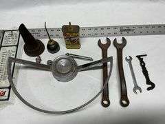Steering wheel, thermometers, oil cans, wrenches