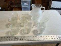 Plastic Kool-Aid pitcher and mugs