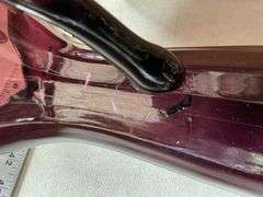 Purple glass pieces-pitcher has a crack by handle