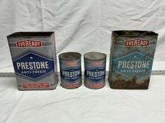 Prestone antifreeze cans (2 full, 2 empty)