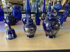 Blue bottles/glassware/oil lamp