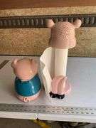 Plastic pig cookie jar and towel holder