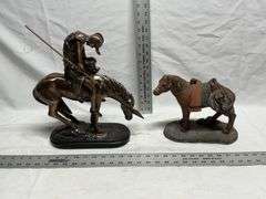 Horse statues, both are missing an ear