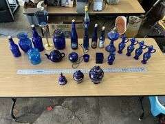 Blue bottles/glassware/oil lamp