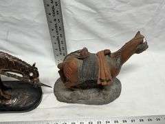 Horse statues, both are missing an ear