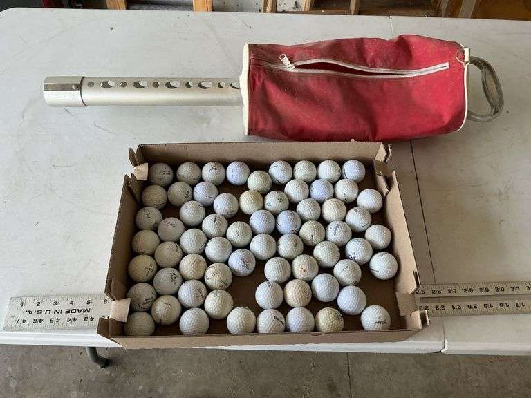 Golf balls and golf ball pick-up tool