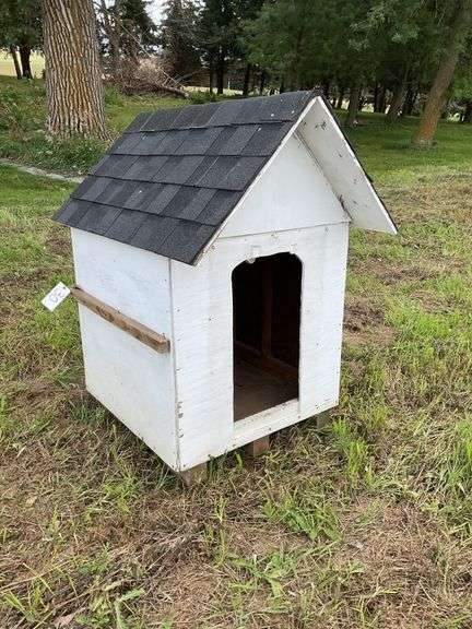 Wood doghouse, new shingles