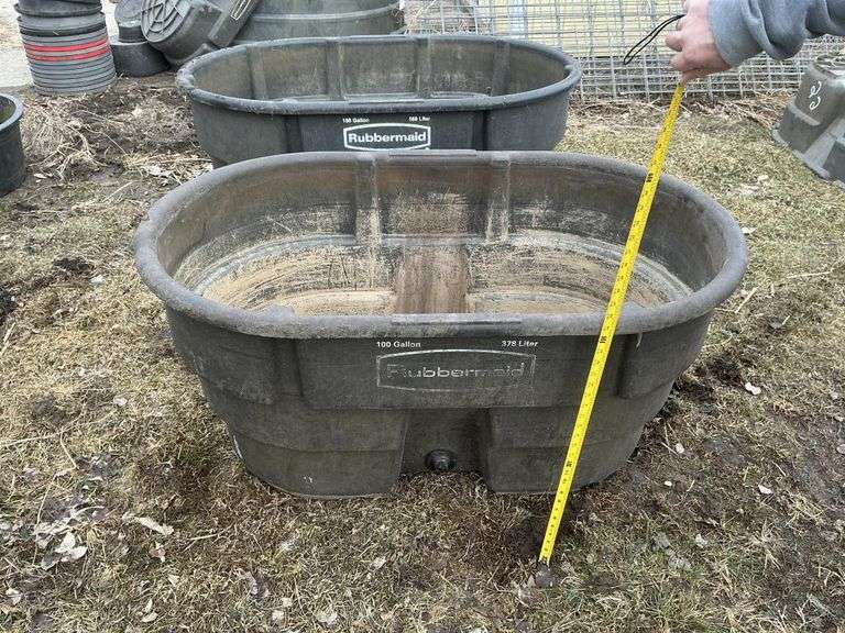 Two Rubbermaid stock tanks, both have cracks