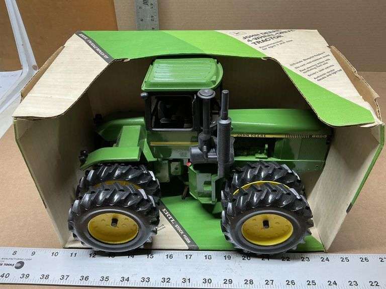 John Deere 4-WD tractor with custom wheels,