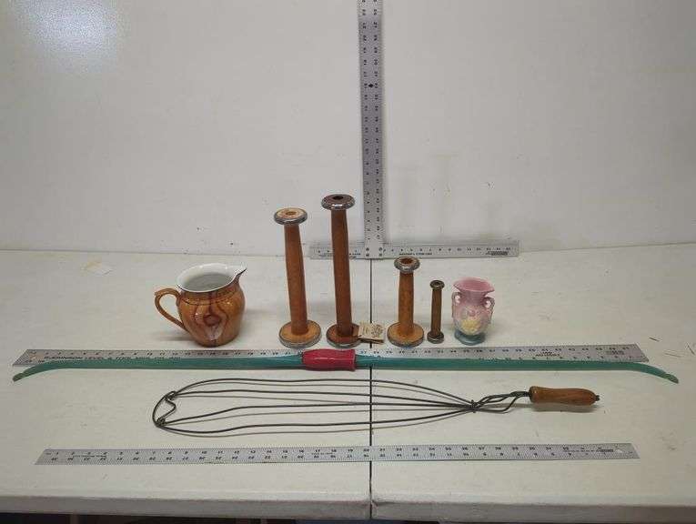 Rug beater, wooden bobbins, pitcher, Paul Bunyan