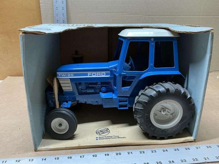 Ford TW-25 tractor, muffler is enclosed
