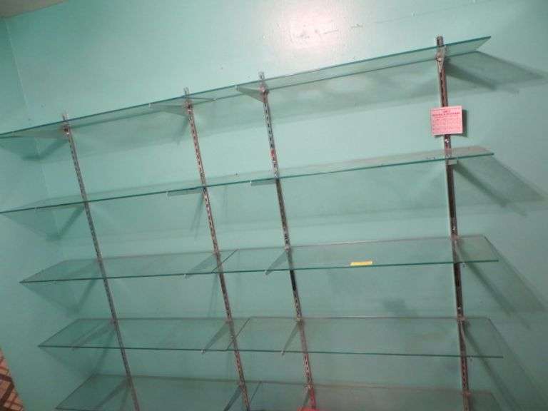 Two Sections of Glass Wall Mounted Shelves