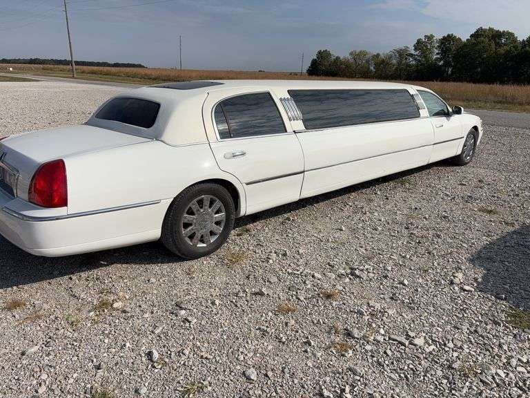 (TITLE) 2004 Lincoln Limousine, 101106.3 miles, Am/FM ,CD, cassette tape, AC/Heat does work, Leather Seats back seat has tear, Power Windows and Locks, Driver Seat Powered, Passenger Seat Manual, White Vinyl Top some Cracks in it, Sun roof, Room for 8 rear Passengers, Bar area with Cooler, Champaign Bottle Well, Glasses for Drinks, carpeted Floors, Rear Stereo System, Rear Climate Control, Starts and Runs, Tire have 70% tread left, Both Side Lower & Upper Quarter Panels have Rust, Driver Side Rear Door does not Open, 4.6 L V8,