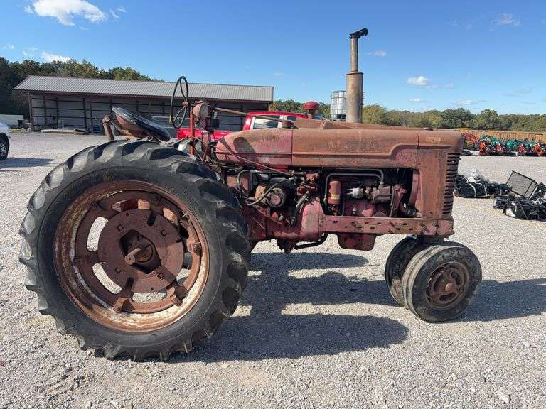 Farmall M, Starts and Runs, Dead Battery, Rear Hydraulics, 540 PTO, Paint is Faded with Surface Rust, Tires Hold Air, Front Wheels have weights, Rear Wheels have weights,