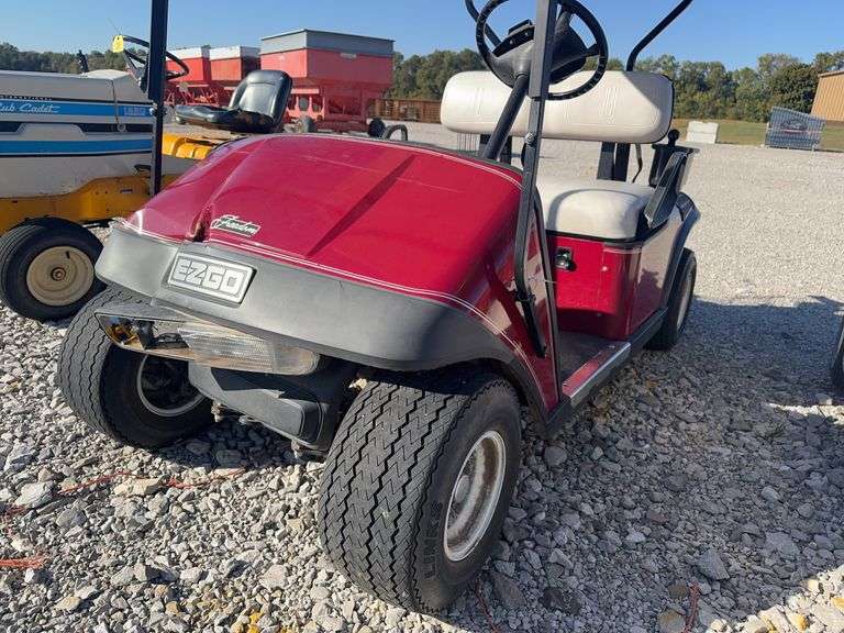 E-Z-Go Gas Golf Cart, Starts and Runs, Front has Damage, Good Tread on Tires, Seats has no Rips or Tears, Canopy Roof,