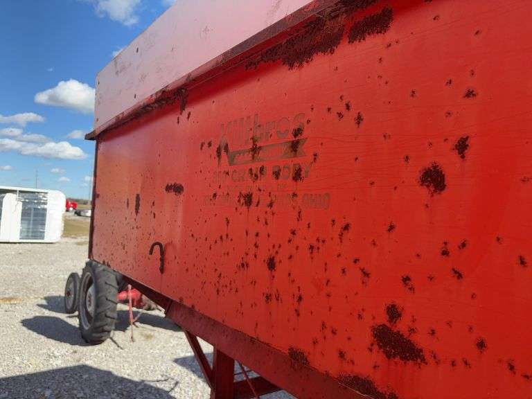 Killbros 350 Bushel Gravity  Wagon, Tires hold Air, Has Surface Rust, No holes in Floor, Hopper Door does work, Pulled to Auction Site, Sells With Hopper And Hydraulic Seed Auger.