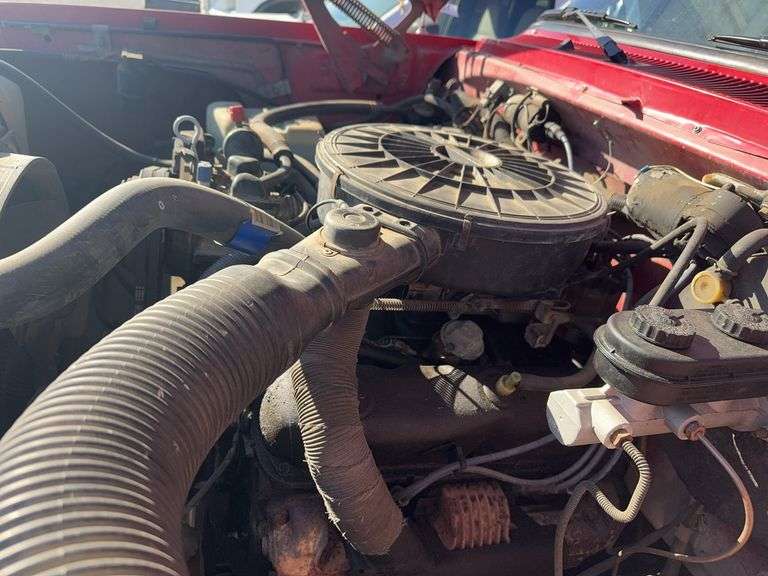 (TITLE) 1988 Dodge 2 Door 4wd Pick Up, 318 V 8 Gas Engine, Title in Hand, 58004 miles, Back Fender Wells Rusted Out, Dents and Dings on Both Sides of Truck, Tailgate Dented and Does Not Open, Passenger Side missing some Trim Pieces, Automatic, AM/FM Radio, AC/Heat, AC not Very Cold, Vinyl Floors, 8 cylinder Gas Engine, New Battery , Newer Tires, Starts and Runs, Driven to Auction Site, Lights Work, Formerly Owned By Dan Balla from Donnellson, He Farmed And Would Drive Around The Community Real Slow Visiting Neighbors. Mileage Is Original.