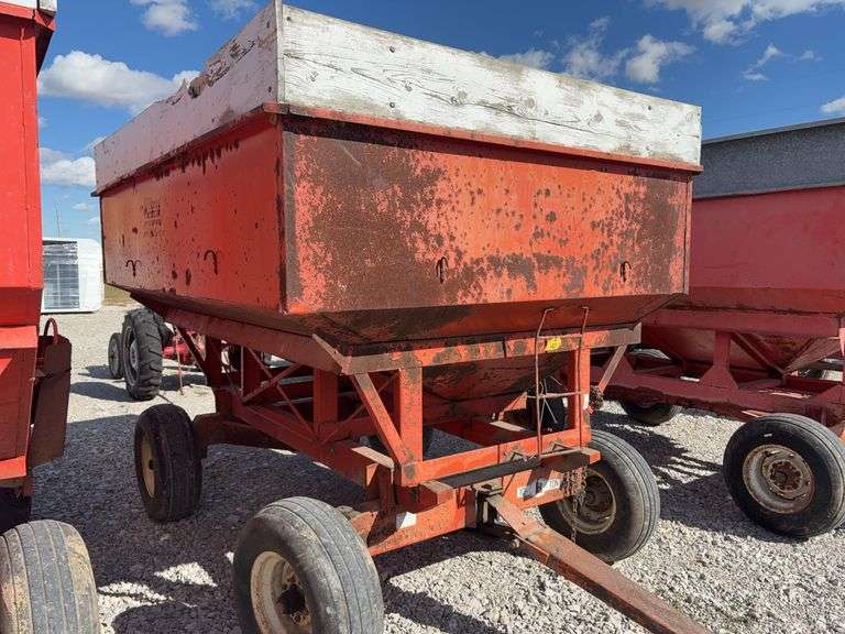 Killbros 350 Bushel Gravity  Wagon, Tires hold Air, Has Surface Rust, No holes in Floor, Hopper Door does work, Pulled to Auction Site, Sells With Hopper And Hydraulic Seed Auger.