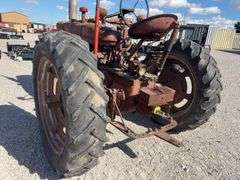 Farmall M, Starts and Runs, Dead Battery, Rear Hydraulics, 540 PTO, Paint is Faded with Surface Rust, Tires Hold Air, Front Wheels have weights, Rear Wheels have weights,