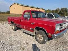(TITLE) 1988 Dodge 2 Door 4wd Pick Up, 318 V 8 Gas Engine, Title in Hand, 58004 miles, Back Fender Wells Rusted Out, Dents and Dings on Both Sides of Truck, Tailgate Dented and Does Not Open, Passenger Side missing some Trim Pieces, Automatic, AM/FM Radio, AC/Heat, AC not Very Cold, Vinyl Floors, 8 cylinder Gas Engine, New Battery , Newer Tires, Starts and Runs, Driven to Auction Site, Lights Work, Formerly Owned By Dan Balla from Donnellson, He Farmed And Would Drive Around The Community Real Slow Visiting Neighbors. Mileage Is Original.