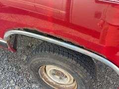 (TITLE) 1988 Dodge 2 Door 4wd Pick Up, 318 V 8 Gas Engine, Title in Hand, 58004 miles, Back Fender Wells Rusted Out, Dents and Dings on Both Sides of Truck, Tailgate Dented and Does Not Open, Passenger Side missing some Trim Pieces, Automatic, AM/FM Radio, AC/Heat, AC not Very Cold, Vinyl Floors, 8 cylinder Gas Engine, New Battery , Newer Tires, Starts and Runs, Driven to Auction Site, Lights Work, Formerly Owned By Dan Balla from Donnellson, He Farmed And Would Drive Around The Community Real Slow Visiting Neighbors. Mileage Is Original.