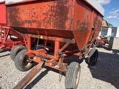 Killbros 350 Bushel Gravity  Wagon, Tires hold Air, Has Surface Rust, No holes in Floor, Hopper Door does work, Pulled to Auction Site, Sells With Hopper And Hydraulic Seed Auger.