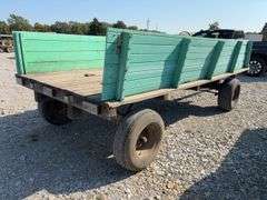 John Deere Wood Wagon, Hydraulic Dump w/ Cylinder, 24” Side Boards, 14’ long x 7’ wide, Front Side Board Has Broken Boards, Back Side Board is warped, Worn Tires That Hold Air.