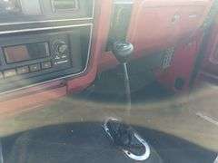 (TITLE) 1988 Dodge 2 Door 4wd Pick Up, 318 V 8 Gas Engine, Title in Hand, 58004 miles, Back Fender Wells Rusted Out, Dents and Dings on Both Sides of Truck, Tailgate Dented and Does Not Open, Passenger Side missing some Trim Pieces, Automatic, AM/FM Radio, AC/Heat, AC not Very Cold, Vinyl Floors, 8 cylinder Gas Engine, New Battery , Newer Tires, Starts and Runs, Driven to Auction Site, Lights Work, Formerly Owned By Dan Balla from Donnellson, He Farmed And Would Drive Around The Community Real Slow Visiting Neighbors. Mileage Is Original.