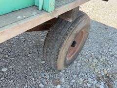 John Deere Wood Wagon, Hydraulic Dump w/ Cylinder, 24” Side Boards, 14’ long x 7’ wide, Front Side Board Has Broken Boards, Back Side Board is warped, Worn Tires That Hold Air.