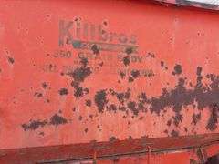 Killbros 350 Bushel Gravity  Wagon, Tires hold Air, Has Surface Rust, No holes in Floor, Hopper Door does work, Pulled to Auction Site, Sells With Hopper And Hydraulic Seed Auger.