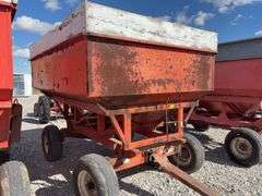 Killbros 350 Bushel Gravity  Wagon, Tires hold Air, Has Surface Rust, No holes in Floor, Hopper Door does work, Pulled to Auction Site, Sells With Hopper And Hydraulic Seed Auger.
